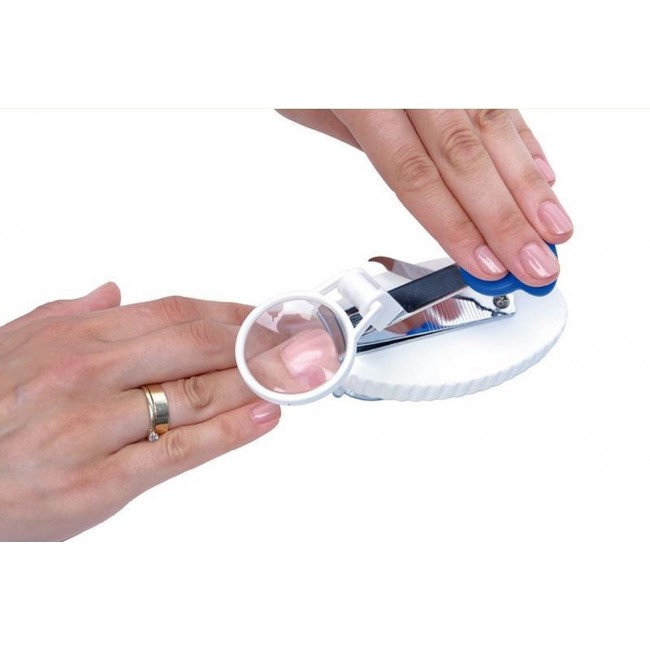 Nail clippers with magnifying glass